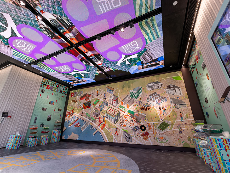 A spacious room featuring a large map on the wall, serving as a hub for design enthusiasts and community gatherings.