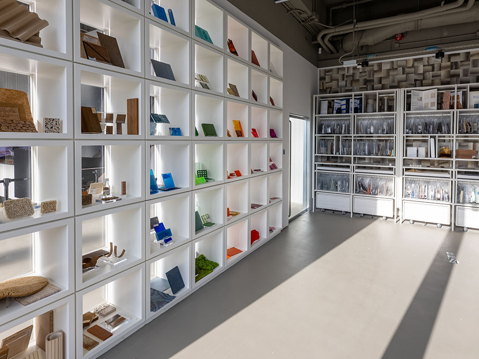 A dynamic room with shelves packed with various unique materials, designed to spark creativity and inspire new ideas.