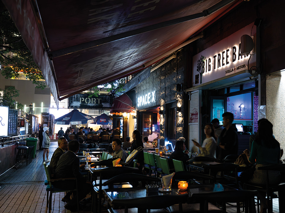 A vibrant evening scene at Knutsford Terrace, filled with outdoor dining.