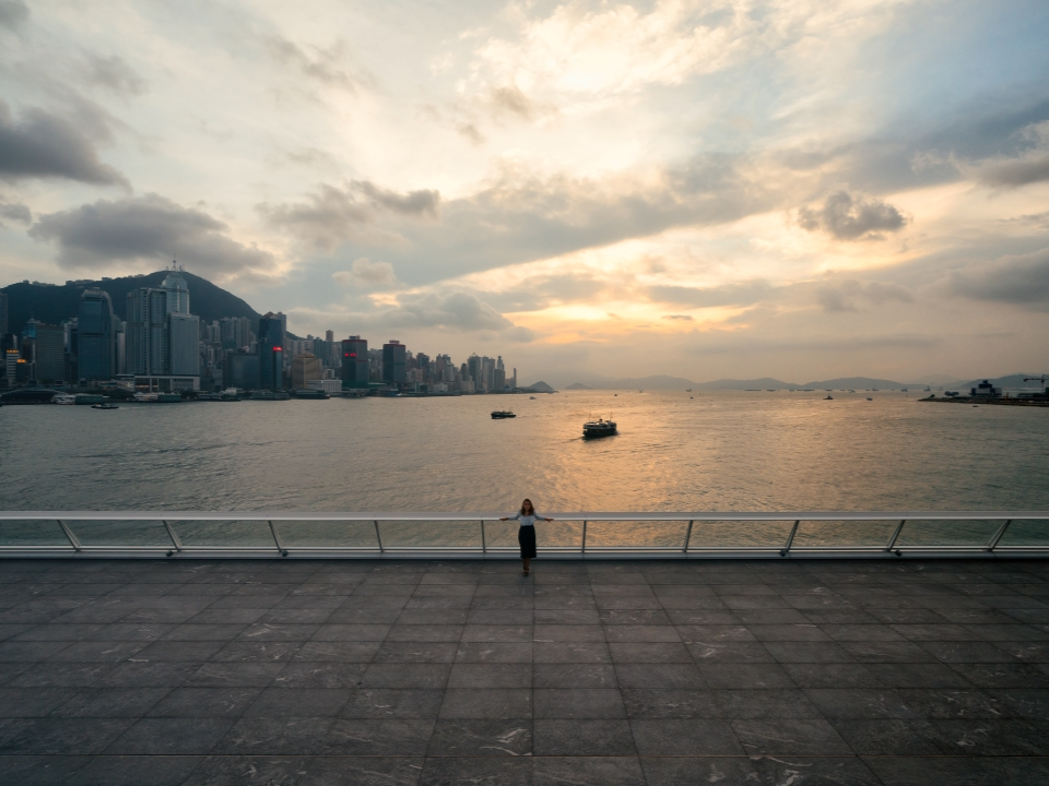 Woman takes in the panoramic skyline views from Ocean Terminal Deck