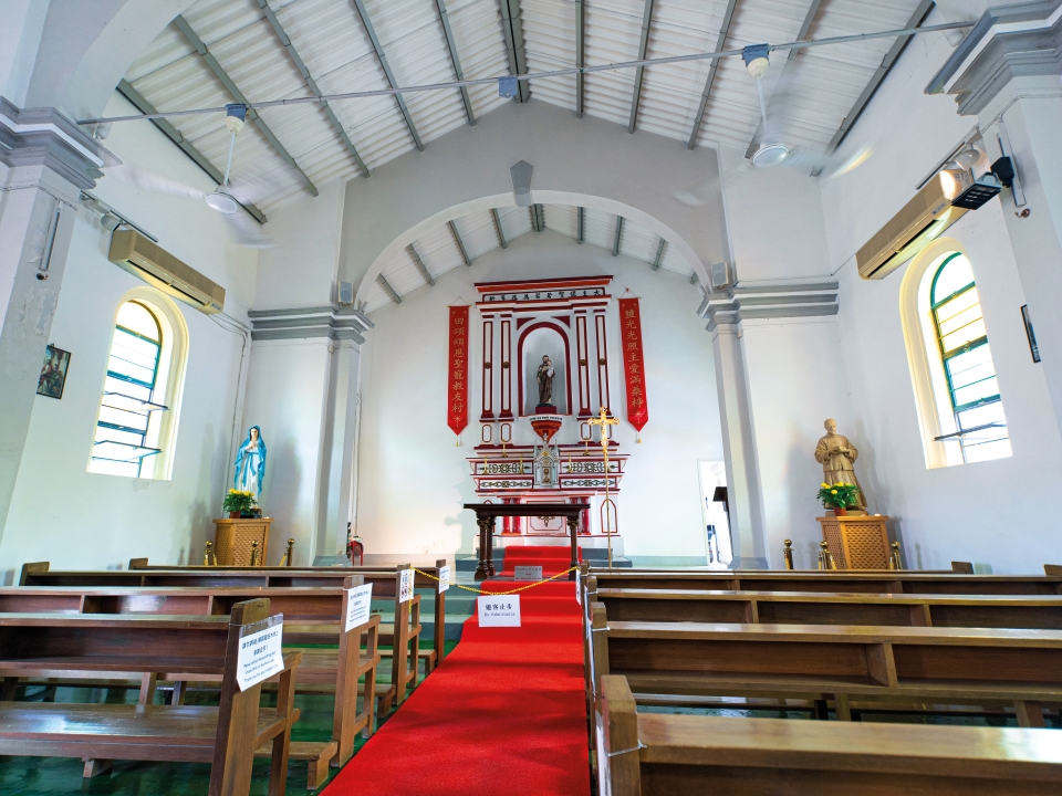 White walled interior of St Joseph’s Chapel in Yim Tin Tsai.