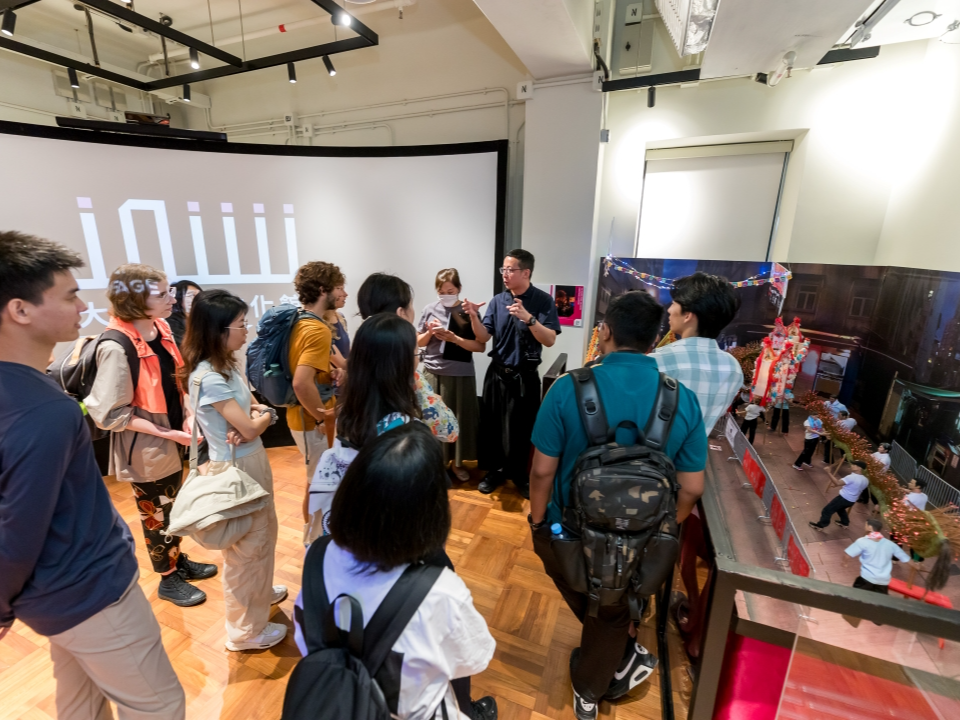  Visitors listen to a demonstration at the Tai Hang Fire Dragon Heritage Centre.