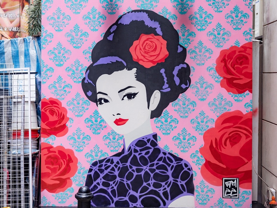 Street art of a lady in a cheongsam by Ange McCalmont in Lan Kwai Fong. 