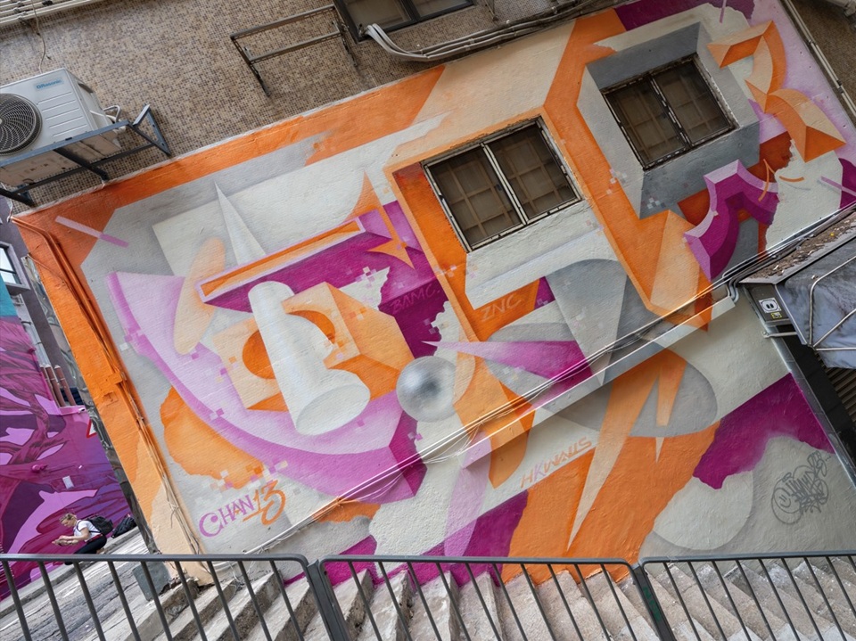 Stairs infront of a colourful art mural by Chan13 on Square Street. 