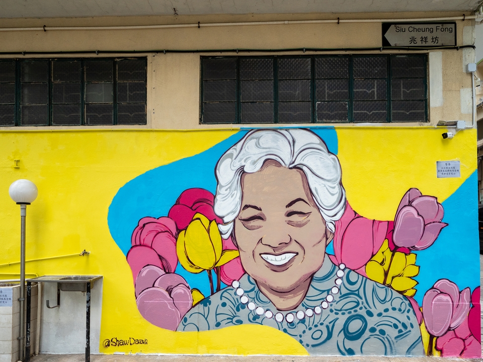 Shaw Daan’s mural depicting a mother smiling lovingly. 