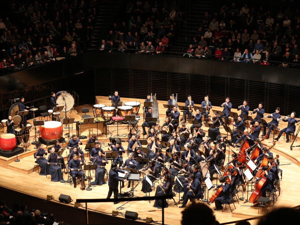 A large orchestra playing at the Chinese Culture Festival.