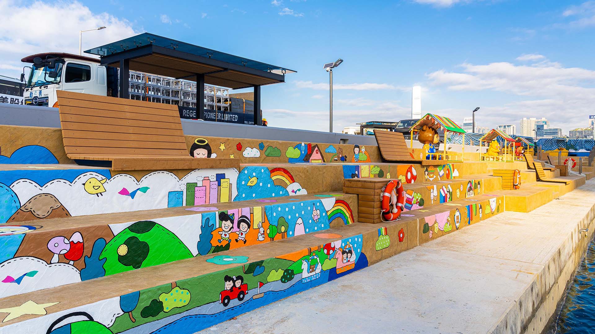 The Wan Chai Promenade features colourful installations at the harken to Hong Kong’s past.