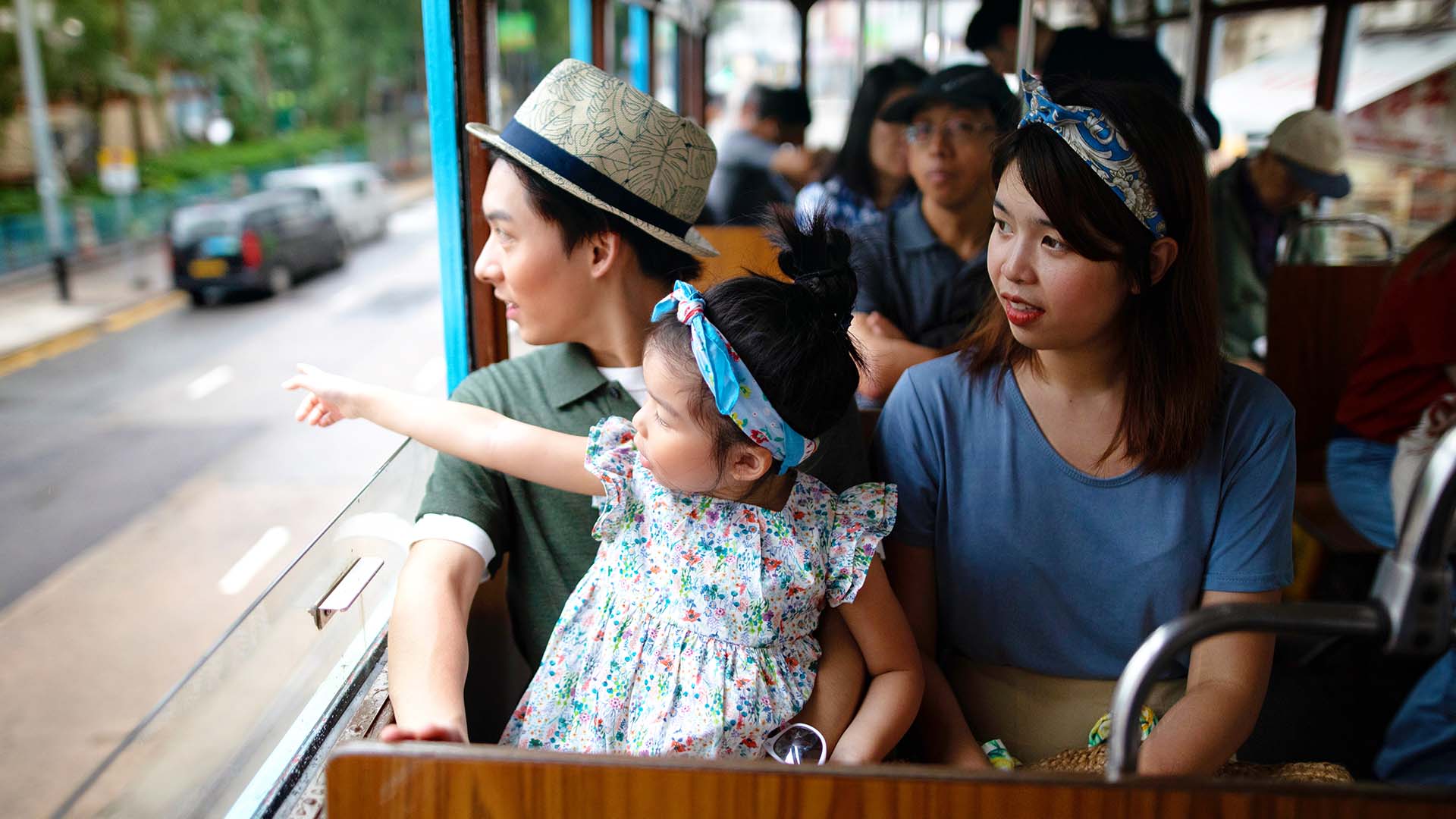 A family enjoying the view from the tram