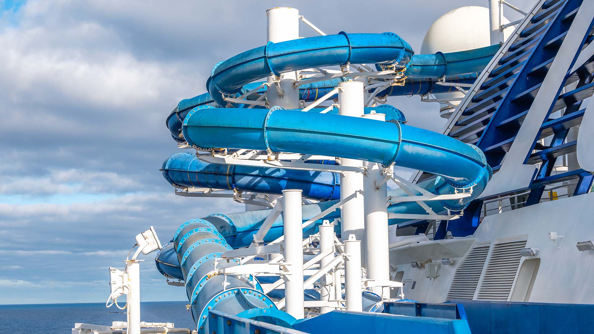 A long, blue waterslide on the Star Voyager cruise ship.