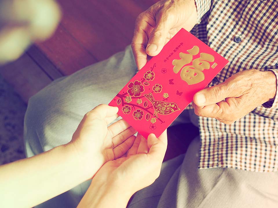 Spread holiday cheer with lai see, or red packets.