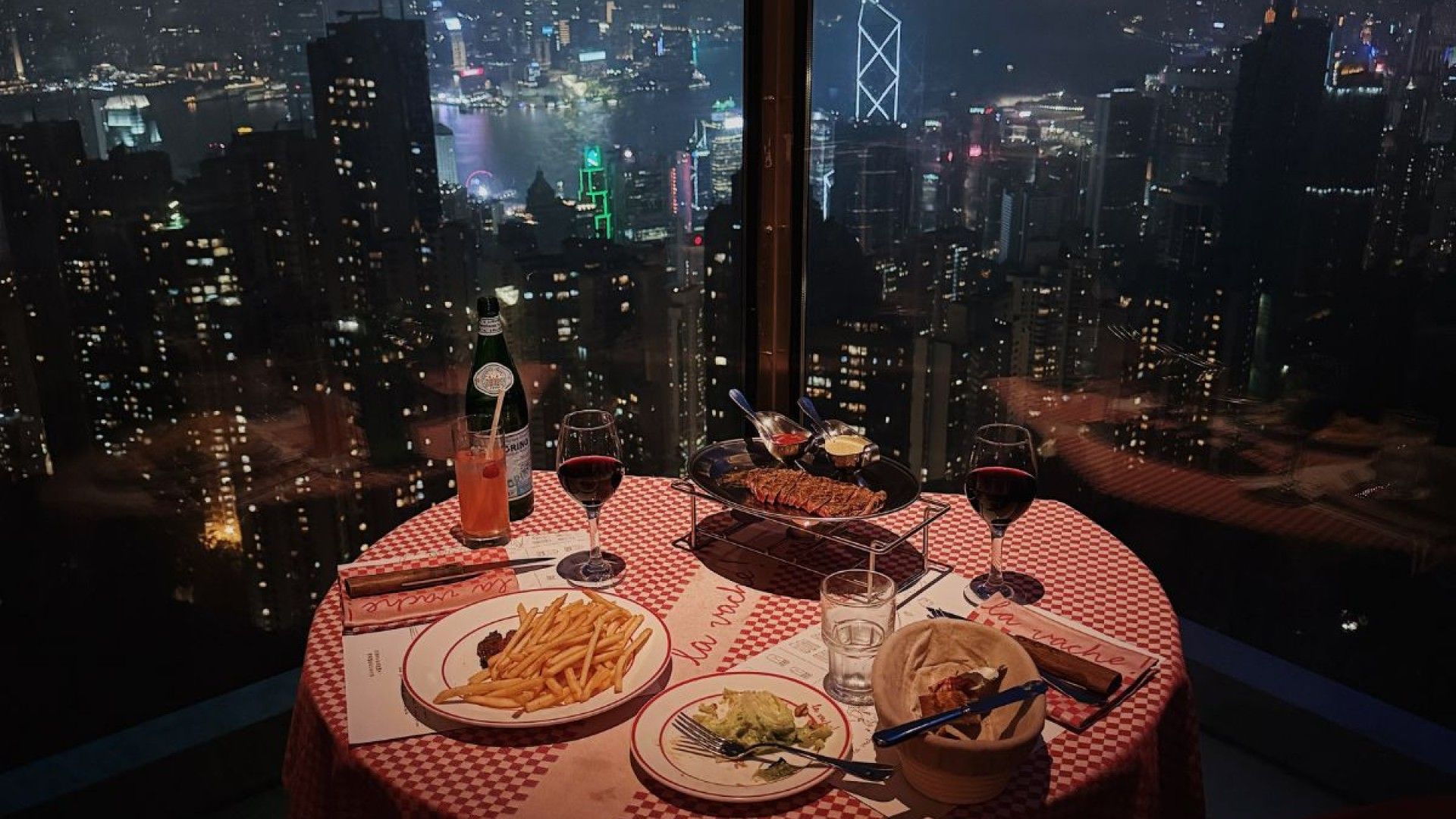 Interior of La Vache with view of Hong Kong Island and Kowloon skyline.