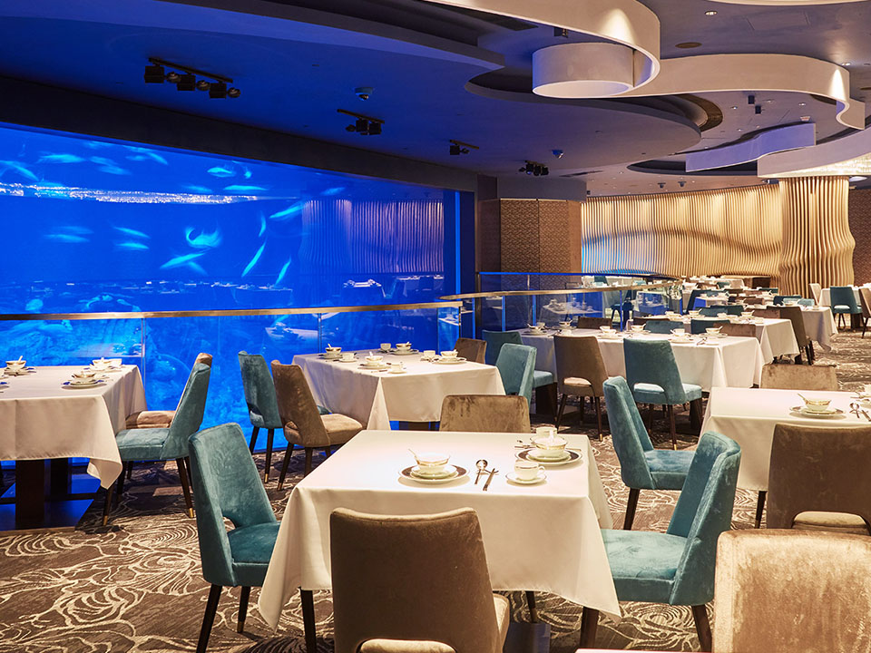 Neptune’s Restaurant with a large aquarium of fish as its backdrop.