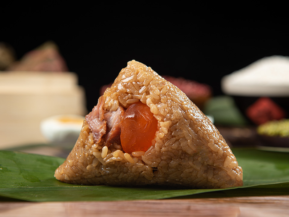 Cantonese-style zongzi is stuffed with pork belly, mushrooms, dried scallops and salted egg yolk
