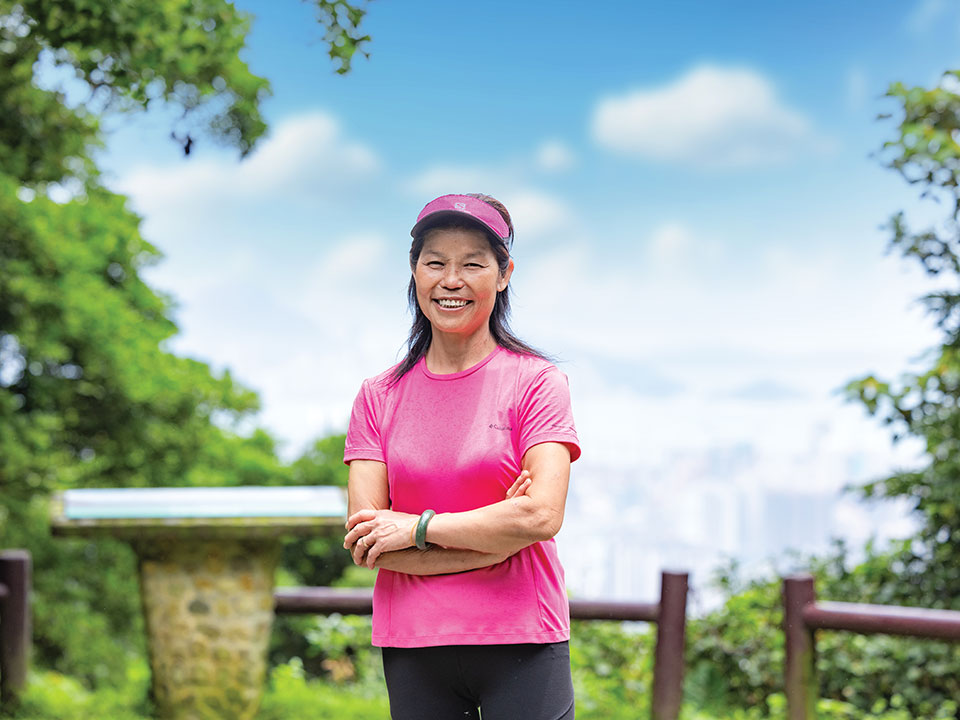 Lin Jei enjoys the breathtaking panoramas of the city at the Tai Mo Shan Lookout