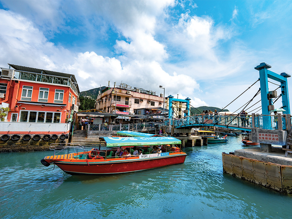 Cruise ship under Tai O Creek Pedestrian Bridge