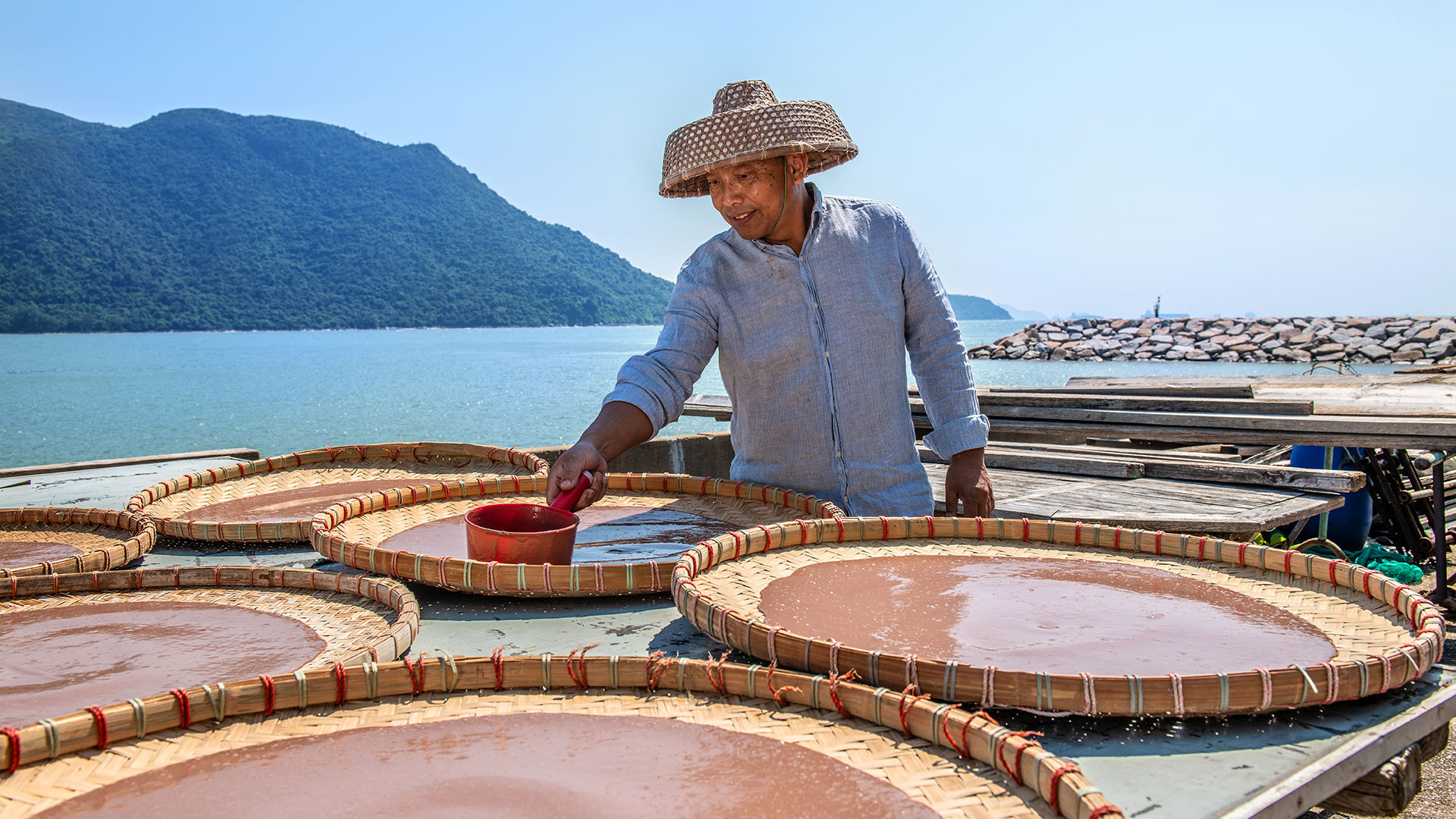 Man making dried shrimp paste