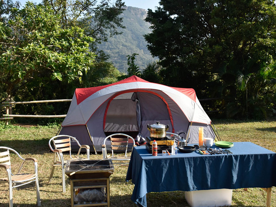 Tent with picnic table and chairs