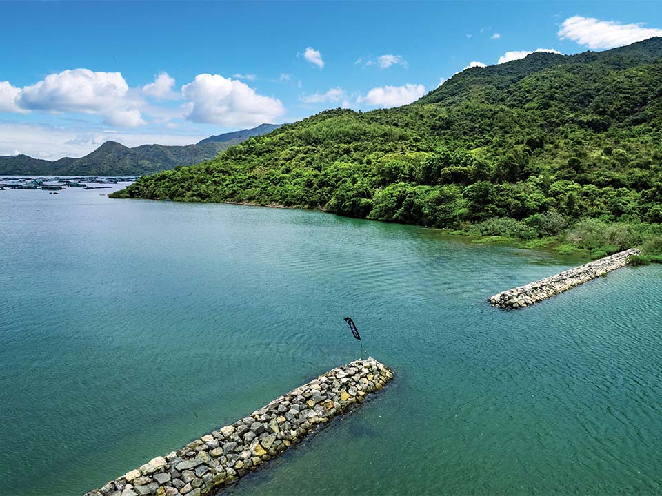 Paddle through the breakwater from Three Fathoms Cove