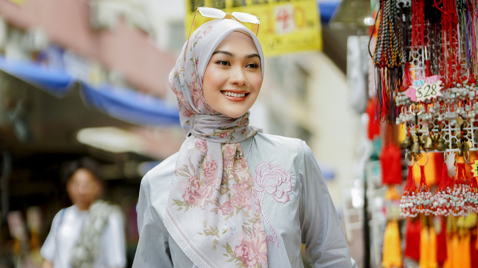 Indah Nada Puspita standing visiting a market in Hong Kong.