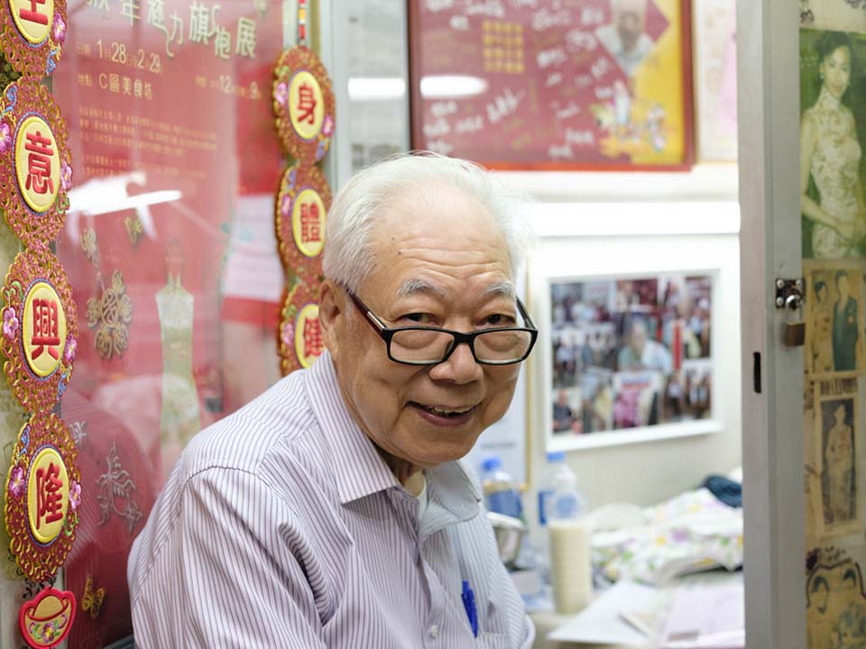 Master Yan Ka-man sitting at the doorway of his Jordan shop