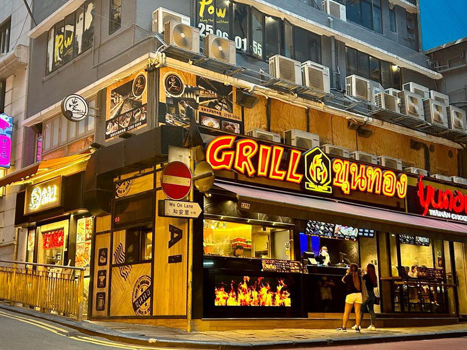 Lit up exterior of GRILL restaurant in Lan Kwai Fong